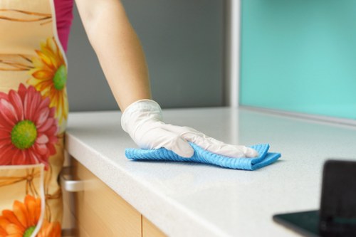 Airbnb cleaner preparing a Ruislip short-let living room for new guests