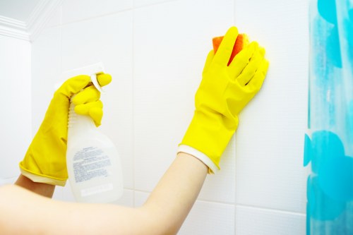 Staff member wearing PPE during professional cleaning work